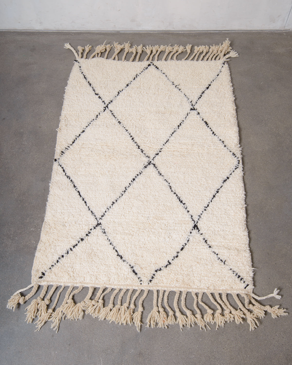 Modern, designer, handcrafted Berber rug from Morocco. Beniourain carpet with minimalist design, natural wool pile and a fluffy texture.